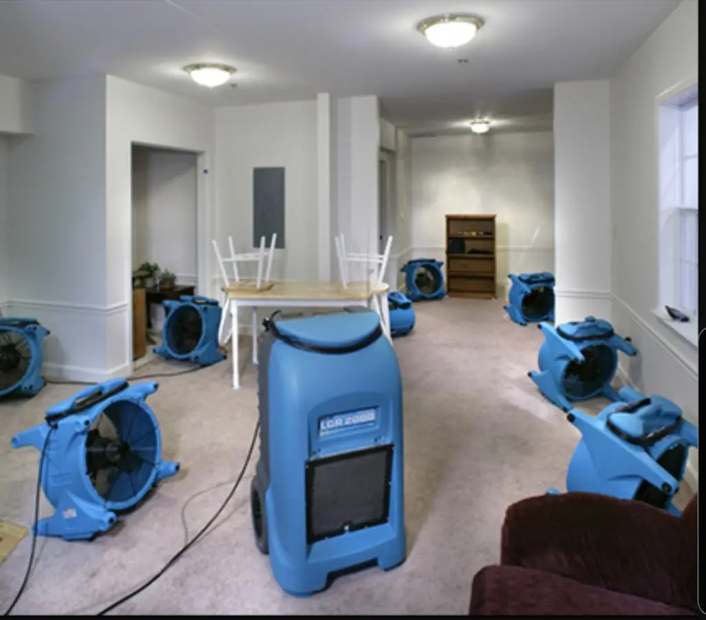 Air movers and dehumidifier setup for Water Damage Restoration in Malverne